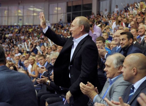 Russian President Vladimir Putin greets spectators at the 2014 World Judo Championships in Chelyabinsk